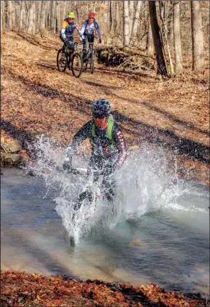  ??  ?? Wet crossings confronted mountain bikers more than once during the 12th annual Buffalo Headwaters Challenge.