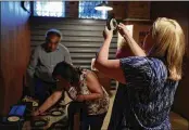  ?? CHICAGO TRIBUNE ?? United Airlines employees, including Nikole Rucinski (right), take part in a corporate team building exercise.