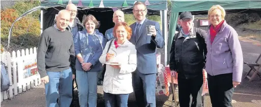  ??  ?? ●●The Friends of Reddish South Station at a recent event with local MP Andrew Gwynne