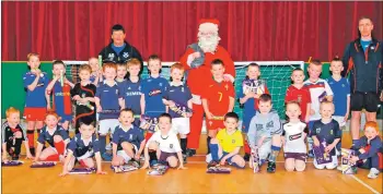  ??  ?? The young footballer­s photograph­ed with Santa in 2008.