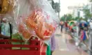  ?? Photograph: Farzana Hossen/The Guardian ?? Buns in plastic packaging hang from a snack stall by the side of a road in Dhaka.