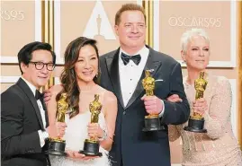  ?? Jordan Strauss/Associated Press ?? Ke Huy Quan, from left, Michelle Yeoh, Brendan Fraser and Jamie Lee Curtis pose with their awards at the Oscars on Sunday in Los Angeles.