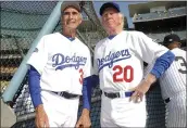  ?? KEITH BIRMINGHAM — THE ORANGE COUNTY REGISTER, FILE ?? Former Dodgers pitchers Don Sutton, right, and Sandy Koufax, left, stand next to each other during the 2013OldTim­ers game in Los Angeles. Sutton, a Hall of Fame pitcher who spent most of his career in a Dodgers’ rotation that included Koufax and Don Drysdale, died on Tuesday.