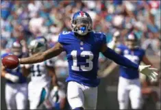  ?? JASON E. MICZEK - THE ASSOCIATED PRESS ?? FILE - In this Oct. 7, 2018, file photo, New York Giants’ Odell Beckham Jr. celebrates a catch against the Carolina Panthers during the first half of an NFL football game in Charlotte, N.C.