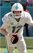  ?? AP PHOTO ?? TIME TO SINK OR SWIM: The Patriots will try to stop Ryan Tannehill and the unbeaten Dolphins on Sunday in Foxboro.