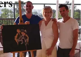  ??  ?? From left: Leading Israeli modern dance performers Niv Sheinfeld and Oren Laor, with painter Jeni Caruana (centre) and one of the paintings the acclaimed internatio­nal dancers will be taking back to Tel Aviv with them