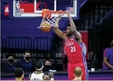  ?? MATT SLOCUM — THE ASSOCIATED PRESS ?? Philadelph­ia 76ers’ Joel Embiid dunk s the ball during the second half of an NBA basketball game against the Utah Jazz, Wednesday, March 3, 2021, in Philadelph­ia.