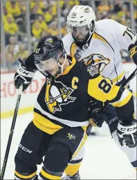  ?? AP PHOTO ?? Nashville Predators’ P.K. Subban (right) checks Pittsburgh Penguins’ Sidney Crosby during Game 2 of the NHL Stanley Cup Final on May 31 in Pittsburgh.