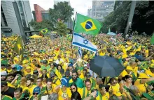  ?? AFP-Yonhap ?? Supporters of former Brazilian President Jair Bolsonaro attend a rally in Sao Paulo, Brazil, Sunday, to reject claims he plotted a coup with allies to remain in power after his failed 2022 reelection bid.