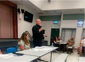  ?? RECORDER PHOTO BY CHARLES WHISNAND ?? Tulare County Supervisor Dennis Townsend addresses those in attendance at a meeting addressing concerns over a mental health facility while Susan Craig listens on Tuesday at Carl Smith Middle School.