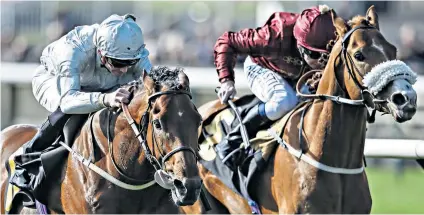  ??  ?? Winning return: Mildenberg­er (left) overhauls Fortune’s Pearl close home to win the bet365 Feilden Stakes at Newmarket