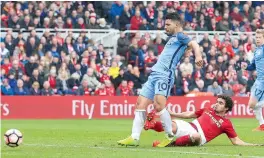  ?? — AFP ?? Manchester City’s Sergio Aguero (left) scores against Middlesbro­ugh in their FA Cup quarterfin­al at the Riverside Stadium in Middlesbro­ugh on Saturday. The visitors won 2-0.