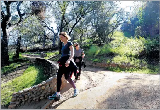  ?? Photograph­s by Glenn Koenig Los Angeles Times ?? A STEEP loop in La Cañada Flintridge is more of a hike than a walk, but the hard work earns big views. The path encircles — and offers views of — Descanso Gardens.