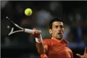  ?? ALESSANDRA TARANTINO — THE ASSOCIATED PRESS ?? Serbia’s Novak Djokovic returns the ball to Norway’s Casper Ruud during their semifinal match at the Italian Open in Rome on Saturday.