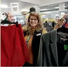  ?? MARTIN DE RUYTER/STUFF ?? Nelson Hospice Shop manager Dianne Timbs recalled a bag of designer clothes accidental­ly donated.