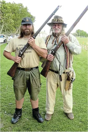  ?? Pictures: SID PENNEY ?? BIG BANG: The 432 participan­ts in the Rapportrye­rs/PJ Olivier fun run/walk at the end of October were on the receiving end of a thunderous blast from the ancient tower musket of battle re-enactment specialist Basil Mills, right. His son Steven Mills, left, was on hand with his own tower musket in case of a misfire. The duo has become a popular feature at local fun runs, cycle tours, half-marathons and other events.