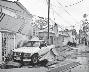  ??  ?? Hurricane Maria tore through Puerto Rico, home to 3.5 million people, taking down the entire power grid and causing untold damage. HECTOR RETAMAL, AFP/GETTY IMAGES