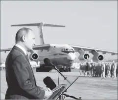  ??  ?? Won’t back down: Vladimir Putin speaks to troops in Syria in December.