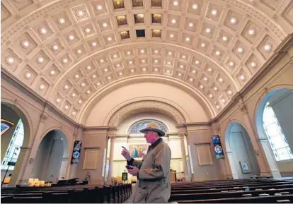  ?? LLOYD FOX/BALTIMORE SUN ?? Michael Riggs describes the interior of the First Unitarian Church of Baltimore as the church marks its 200th anniversar­y.