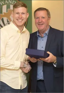  ??  ?? Senior Player of the Year Kevin Lynch accepts his award from Ronnie Whelan.