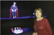  ?? DON BABWIN — THE ASSOCIATED PRESS ?? In this photo, Holocaust survivor Fritzie Fritzshall poses for a portrait in front of her 3D hologram at the Illinois Holocaust Museum in Skokie, Ill.