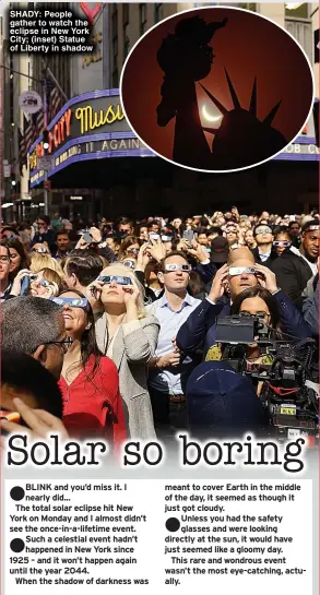  ?? ?? SHADY: People gather to watch the eclipse in New York City; (inset) Statue of Liberty in shadow