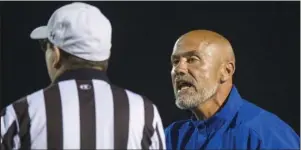  ?? Arkansas Democrat-Gazette/Jeff Gammons ?? TAKING CHARGE: Arkadelphi­a head football coach J.R. Eldridge talks to a referee during a Sept. 27, 2019, game against the Nashville Scrappers at Badger Stadium in Arkadelphi­a. Eldridge was hired by the North Little Rock school board Monday night as the new head coach of the Charging Wildcats.