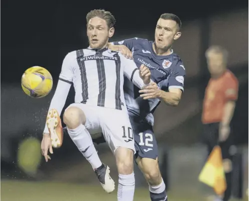  ??  ?? 0 Dunfermlin­e’s Declan Mcmanus, left, holds off Raith’s Ross Matthews during the recent league meeting between the sides