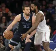  ?? SETH WENIG — THE ASSOCIATED PRESS ?? Grizzlies’ Marc Gasol, left, drives against Knicks’ DeAndre Jordan during a game Sunday at Madsion Square Garden in New York.