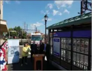  ?? PHOTOS BY DAN SOKIL — FOR DIGITAL FIRST MEDIA ?? A SEPTA bus turns onto Railroad Avenue in Lansdale as Leslie Hickman, SEPTA Chief Officer of Revenue Operations, speaks about the agency’s key card program.