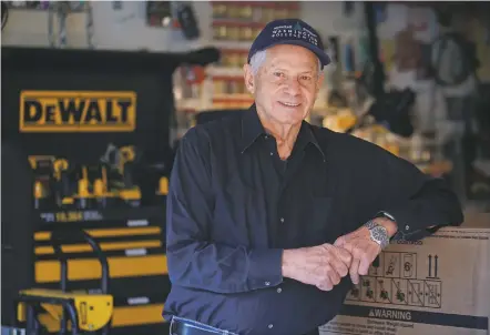  ?? GABRIELA CAMPOS/THE NEW MEXICAN ?? Peyton George, a former FBI agent and now a handyman for seniors in need, stands in his garage surrounded by the tools he uses on jobs around town.