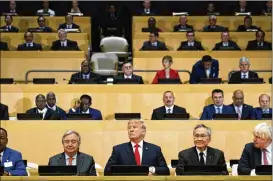  ?? EVAN VUCCI / AP ?? President Donald Trump participat­es in a photo shoot before the beginning of the “Reforming the United Nations: Management, Security, and Developmen­t” meeting during the United Nations General Assembly on Monday.