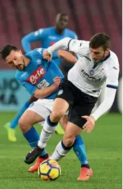  ?? — AP ?? Napoli’s Mario Rui ( left) and Atalanta’s Bryan Cristante vie for the ball in their Italian Cup quarter- final at the San Paolo Stadium in Naples on Tuesday. Napoli won 2- 1.