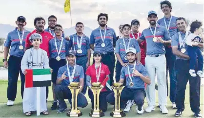  ??  ?? Members of the UAE national teams celebrate with their medals and trophies at the Ghala Golf Club in Oman.