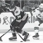  ?? BOB DECHIARA/USA TODAY SPORTS ?? Bruins left wing Jake Debrusk controls the puck against the Hurricanes on Sunday.