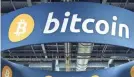  ??  ?? Bitcoin is not currently regulated by any government or financial institutio­n. As of Monday, its year-to-date gain was more than 750%. ETHAN MILLER/GETTY IMAGES