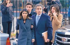  ?? CRAIG RUTTLE/ASSOCIATED PRESS ?? Michael Cohen, second from right, President Trump’s former lawyer, accompanie­d by his children and his wife, arrives at federal court for his sentencing on Wednesday.