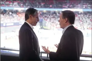  ?? (AP/Mark Schiefelbe­in) ?? U.S. Secretary of State Antony Blinken talks with U.S. Ambassador to China Nicholas Burns (right) while attending a basketball game at the Shanghai Indoor Stadium in Shanghai, China, on Wednesday.