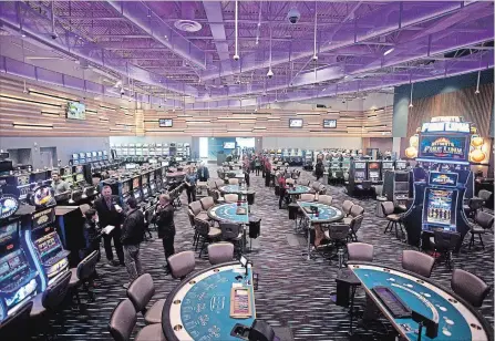  ?? JASON BAIN EXAMINER ?? Gaming machines and card tables on the floor of Shorelines Casino Peterborou­gh as officials provided a tour to media representa­tives prior to the grand opening of the Crawford Drive facility on Monday. The casino opened to the public at 5 p.m.