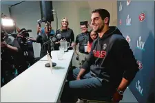  ?? WILFREDO LEE/AP PHOTO ?? San Francisco quarterbac­k Jimmy Garoppolo smiles as he speaks during a media availabili­ty for Super Bowl 54 on Tuesday in Miami.