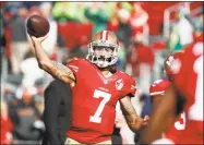  ?? Tony Avelar / Associated Press ?? 49ers quarterbac­k Colin Kaepernick warms up before a game against the Seahawks on Jan. 1, 2017.