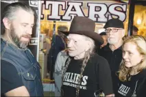  ?? CHRISTOPHE­R DEVARGAS ?? Country music legend Willie Nelson, center, speaks to fans in January 2017 at the Exile on Main vintage clothing store in Las Vegas while promoting his Willie’s Reserve marijuana and weed-related products. A number of Las Vegas dispensari­es offer...