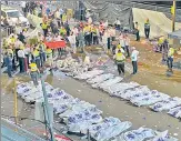  ?? AFP ?? Security officials and rescuers gather bodies of the victims who died in a stampede in Meron.