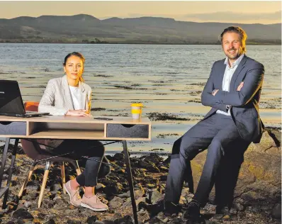  ??  ?? Karen Sweeney and Allan Mulrooney of the Western Developmen­t Commission launching the new online jobs portal in Kellystown near Ransboro, with Ballisodar­e Bay and the Ox Mountains in the background.