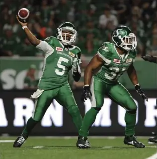  ?? MARK TAYLOR, THE CANADIAN PRESS ?? Saskatchew­an Roughrider­s quarterbac­k Kevin Glenn (5) attempts a pass during second-half action against the Hamilton Tiger-Cats in Regina on Saturday.