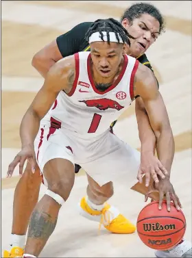  ?? Associated Press ?? Guarded: Missouri's Dru Smith, top, defends against Arkansas' JD Notae (1) in the first half of an NCAA college basketball game in the Southeaste­rn Conference Tournament last week in Nashville, Tenn.