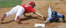  ?? JOHN RAOUX — THE ASSOCIATED PRESS ?? Phillies first baseman Brock Stassi, left, tags out Tampa Bay’s Jake Fraley on a pickoff in the sixth inning Friday in Clearwater, Fla.