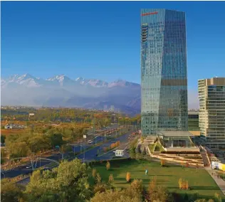  ??  ?? Clockwise from top left: Ritz-Carlton Almaty’s Vista Bar and exterior; Zailysky Alatau mountains