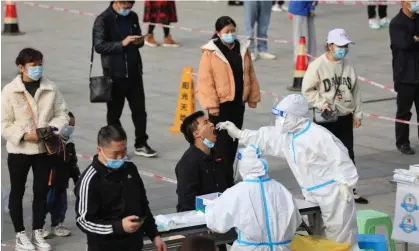  ?? Photograph: Reuters ?? A mass Covid testing in Guizhou province, where 27 people were killed when the bus taking them to a quarantine centre crashed.