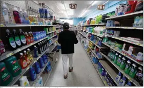  ?? (AP/Charlie Neibergall) ?? Shoppers, like this one Friday in Des Moines, Iowa, have seen the cost of meat, eggs and other staples soar as the coronaviru­s has disrupted processing plants and distributi­on networks. More photos at arkansason­line.com/531food/